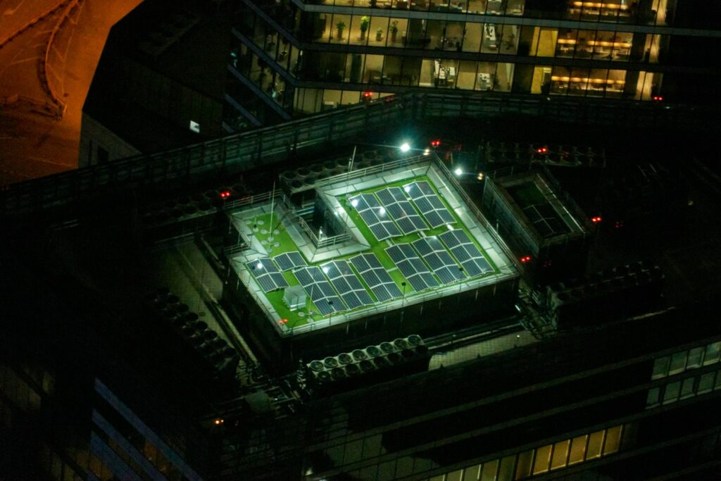 an aerial view of a tennis court at night